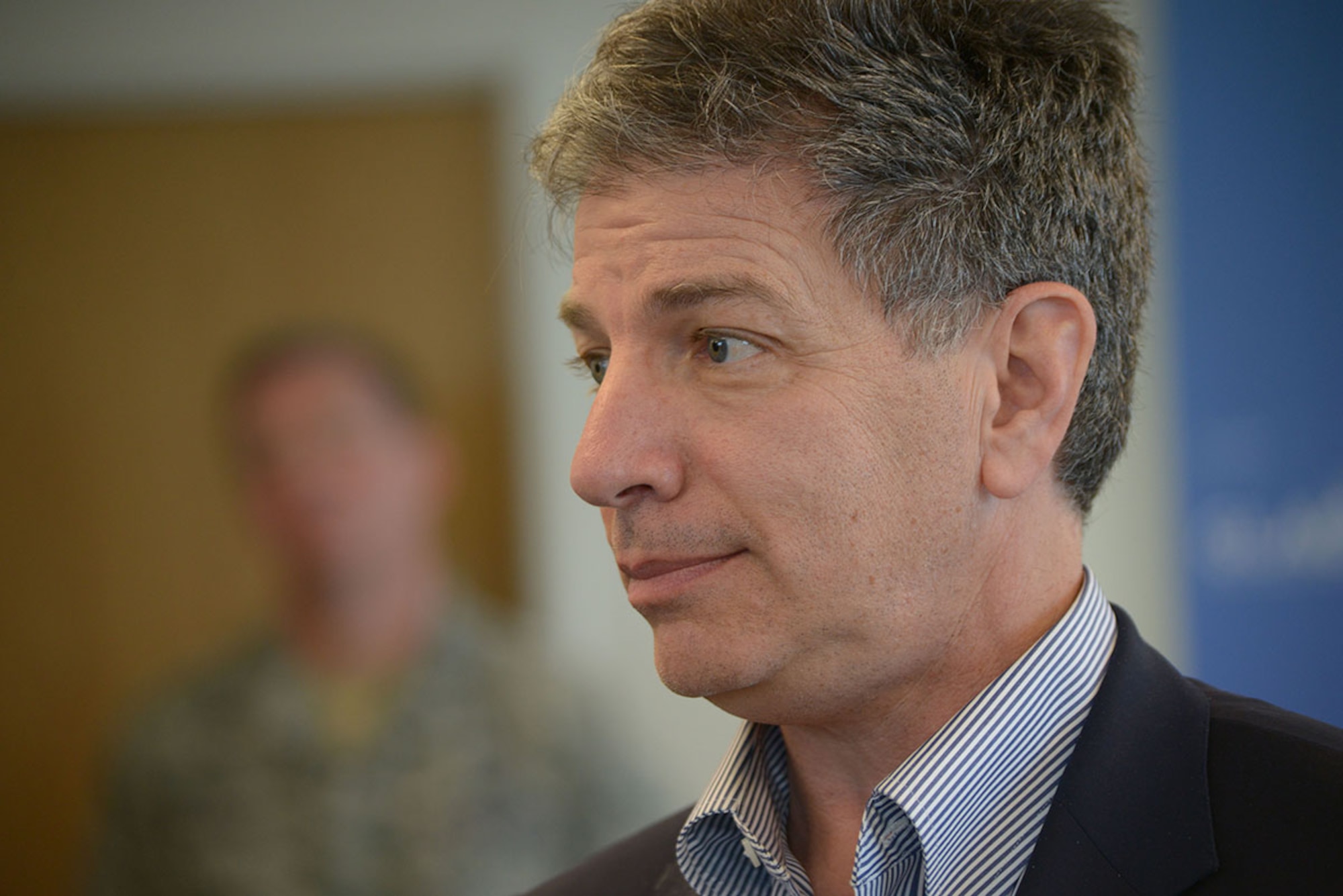 Mayor Ethan Berkowitz, Anchorage mayor, speaks with local media about the Air Force Community Partnership Program as Col. Brian Bruckbauer, Joint Base Elmendorf-Richardson and 673 Air Base Wing commander observes, on April 22, 2016, in Anchorage, Alaska. The AFCP program offers opportunities to military installations and local communities to partner and achieve mutual value and benefit, such as reducing operating and service costs and achieving mutual economic goals and interests.( Air Force photo by SSgt William Banton)