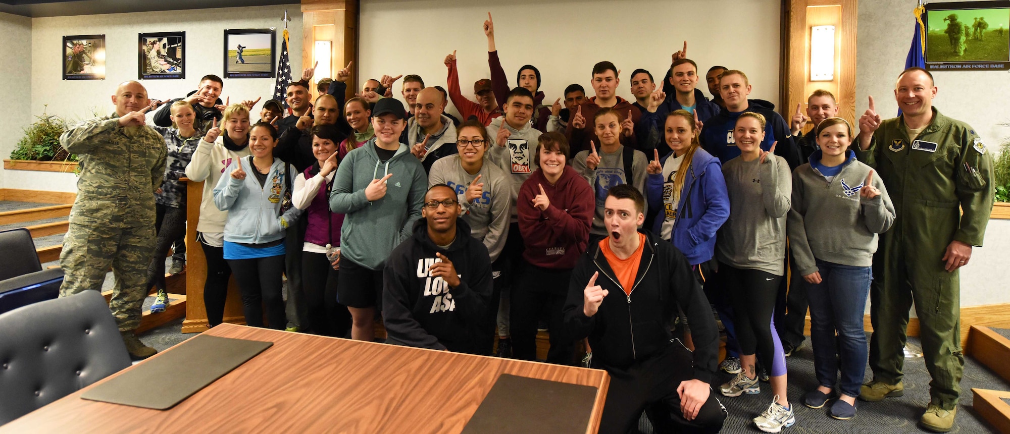 Airmen assigned to the 341st Missile Wing pose for a photo April 27, 2016, at Malmstrom Air Force Base, Mont. The base hosted The Amazing Race: Malmstrom Style, a competitive scavenger hunt in support of Wingman Month. (U.S. Air Force photo/Airman Collin Schmidt)