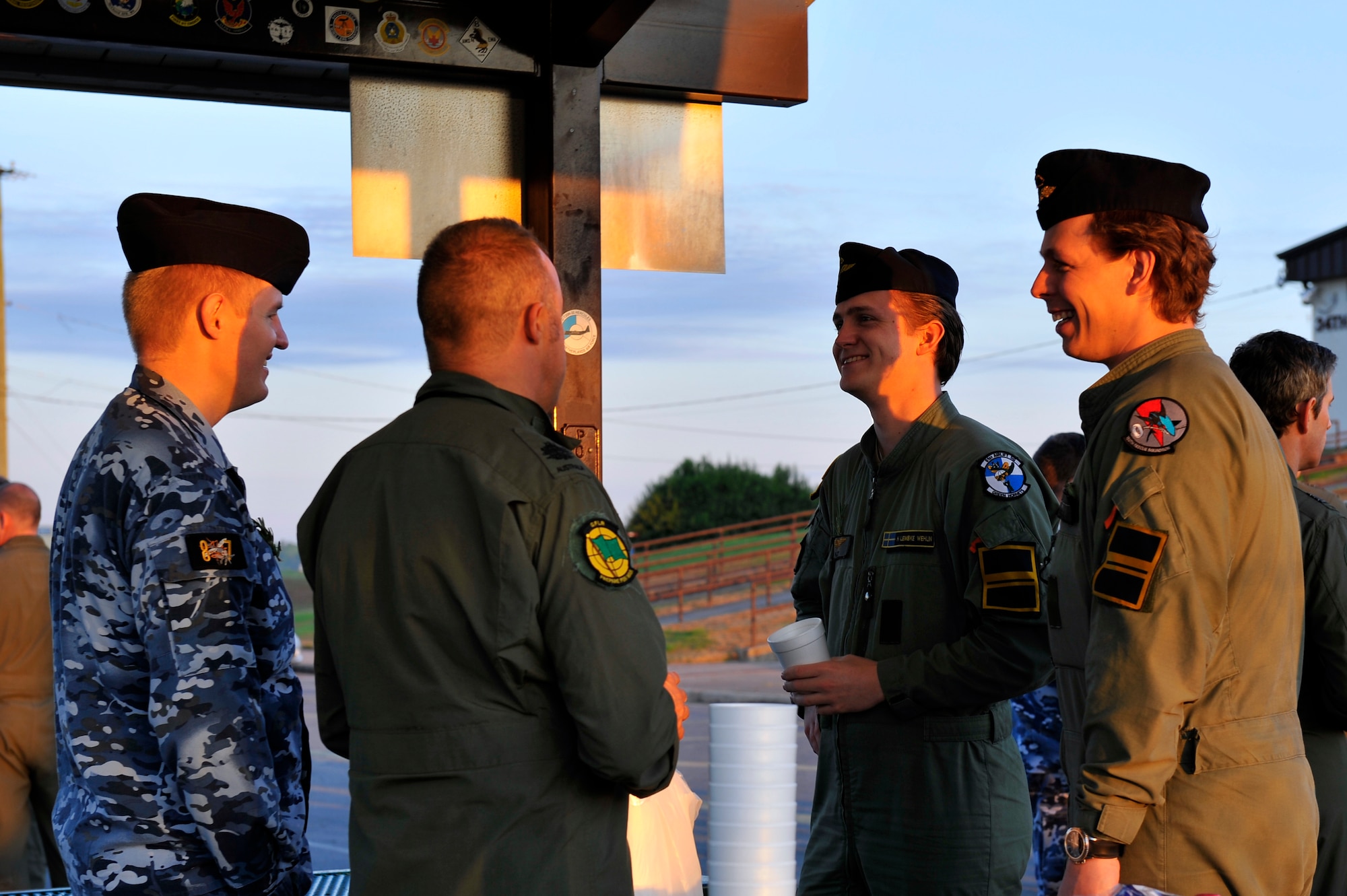 Australian and Swedish Air Force personnel celebrate Australian and New Zealand Army Corps Day over a “gun fire breakfast” April 25, 2016, at Little Rock Air Force Base. A “gun fire breakfast” is an Australian tradition consisting of coffee mixed with nipper rum drank by Word War I Australian soldiers to calm their nerves before battle. (U.S. Air Force photo by Airman Kevin Sommer Giron)