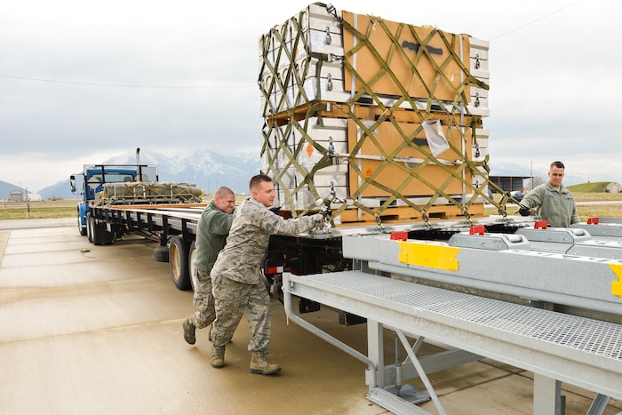 Ammo Airmen assigned to the 649th Munitions Squadron load air-transportable munitions containers onto a staging platform during STAMP training March 31, 2016, at Hill Air Force Base, Utah. 649th MUNS provides “World-Class Munitions Support to the Warfighter.” (U.S. Air Force photo by R. Nial Bradshaw)