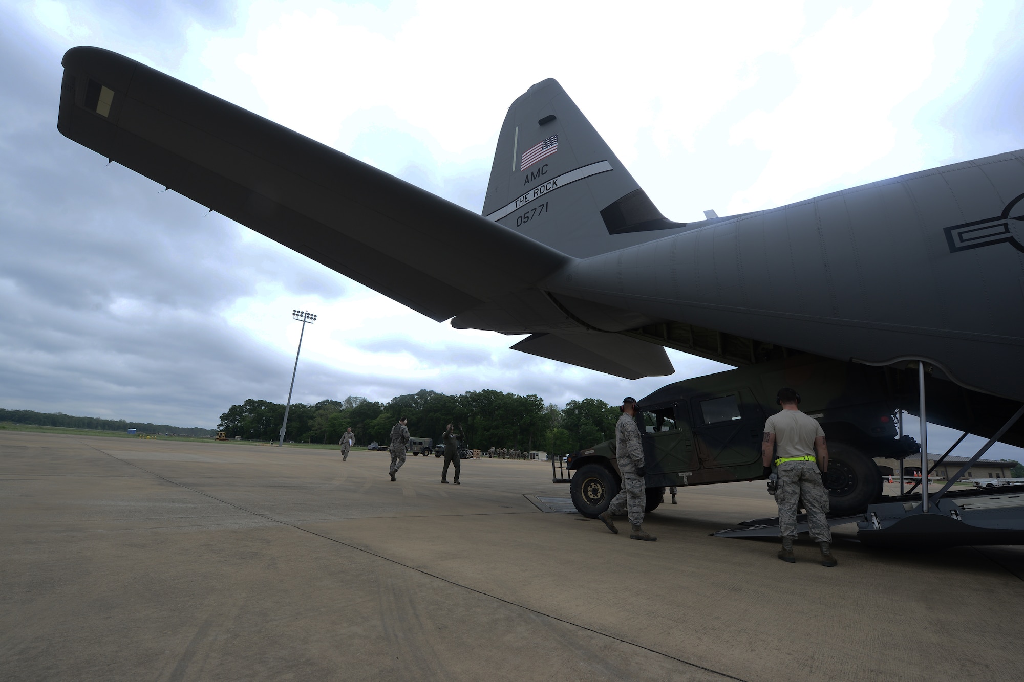 Members of the 621st Contingency Response Squadron Aerial Port team load a HUMVEE onto a C-130 Hercules during a Joint Readiness Training exercise at Alexandria International Airport, LA. April 16, 2016. JRTC is a multinational exercise focused on pre-deployment and airdrop capabilities. (U.S. Air Force photo by Senior Airman Joshua King)