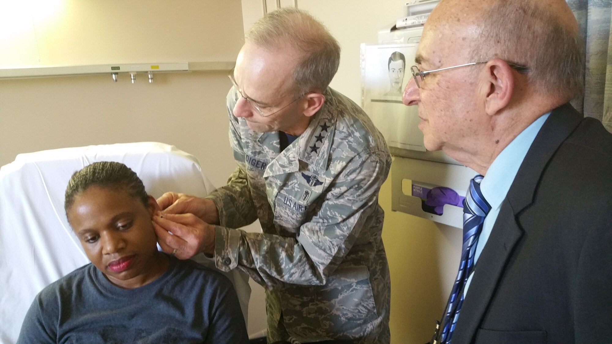 Air Force Surgeon General Lt. Gen. (Dr.) Mark A. Ediger attended Battlefield Acupuncture training taught by Dr. Richard Niemtzow, Director of the Air Force Acupuncture Center on Joint Base Andrews on April 1, 2016. Battlefield Acupuncture is a rapid technique using tiny acupuncture needles inserted into the ears that directly modifies the way the central nervous system processes pain so as to reduce pain significantly in over 80% of patients. The technique was developed by Dr. Niemtzow in 2001. (AF Photo / Matthew Eichie)
