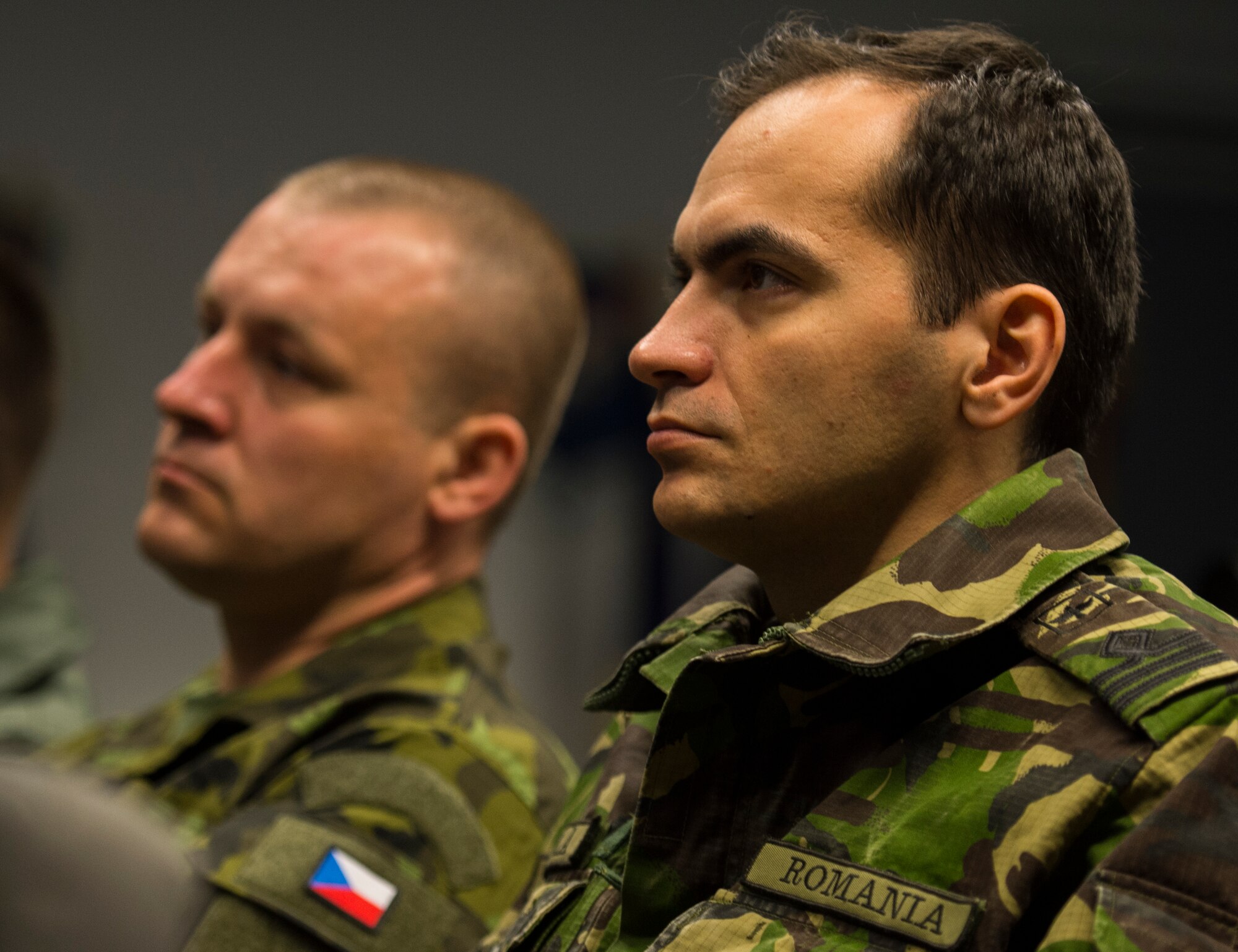 A Romanian air force service member listens to a guest speaker as the first Inter-European Air Forces Academy inaugural in-residence Squadron Officer School and NCO Academy class kicks off April 25, 2016, at Ramstein Air Base, Germany. The class will last for five weeks and is comprised of 31 international air force officers and NCOs from 11 countries. (U.S. Air Force photo/Senior Airman Jonathan Stefanko)