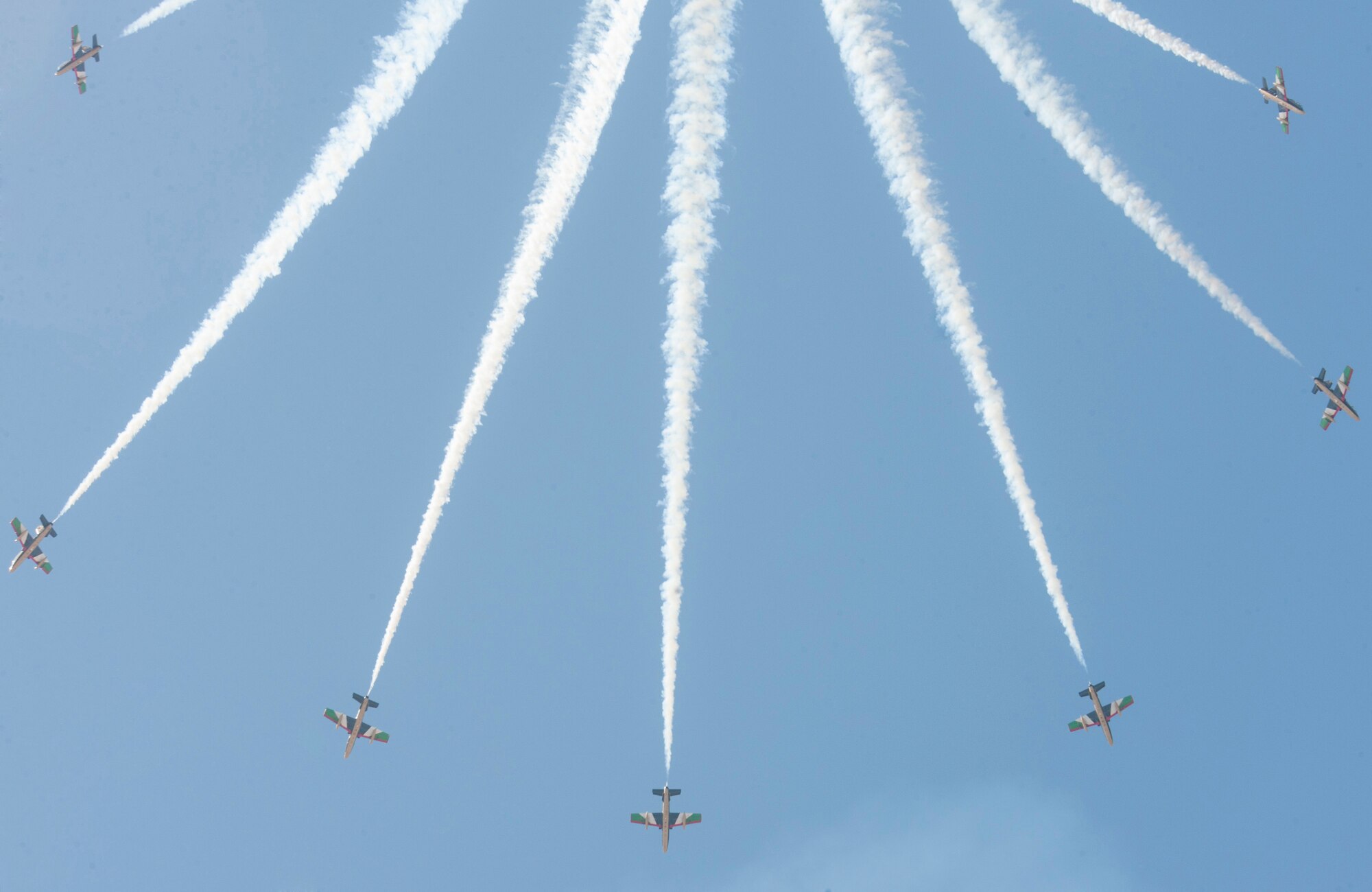 Pilots, with the United Arab Emirates Air Force Aerobatic Display Team, demonstrate the Al Fursan aircrafts inflight capabilities during the International Marrakech Airshow in Morocco on Apr. 27, 2016. Several United States, independent and government owned aircraft were displayed at the expo in an effort to demonstrate their capabilities to a broad audience of individuals from approximately 54 other countries. (DoD News photo by TSgt Brian Kimball)
