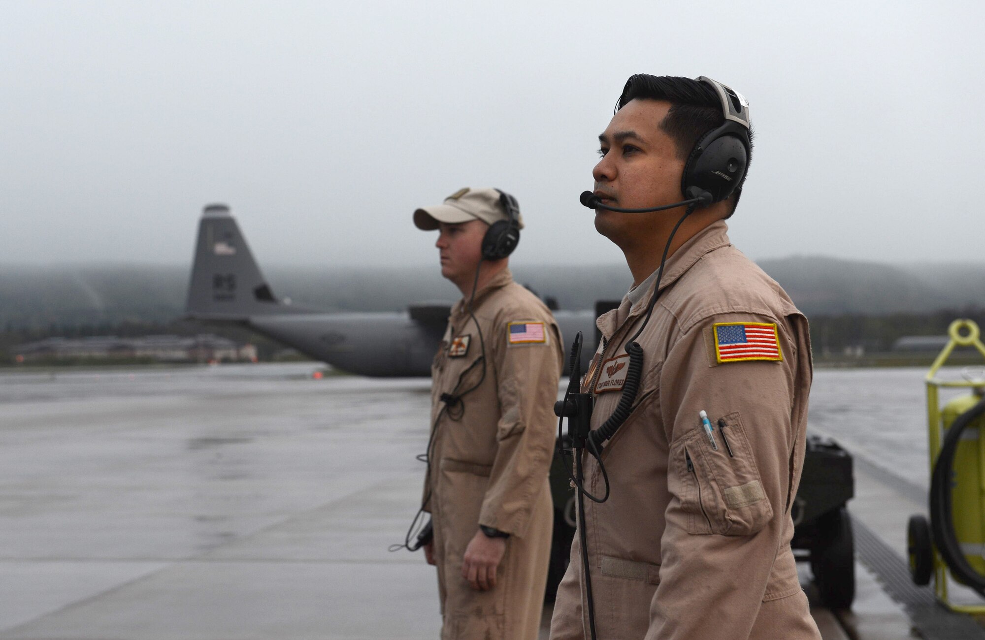 U.S. Air Force Technical Sergeant Gregory Flores (right), a loadmaster with the 37th Airlift Squadron (AS), and U.S. Air Force Staff Sergeant Ryan Gorby, a crew chief with the 86th Aircraft Maintenance Squadron (AMXS), ensure proper engine start up during pre-flight checks on a C-130J Hercules prior to take off from Ramstein Air Base, Germany on Apr. 26, 2016. TSgt Miller is part of a six-man flight crew entrusted with transporting the aircraft to the 2016 International Marrakech Airshow in Morocco and showcasing the aircrafts capabilities. (DoD News photo by TSgt Brian Kimball)