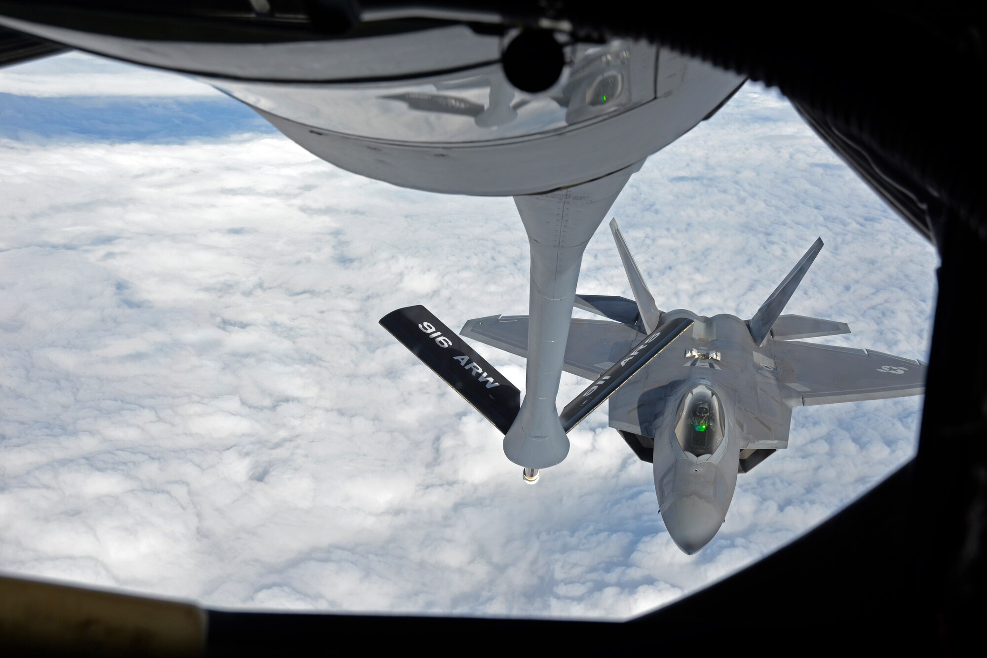 A KC-135 Stratotanker from Seymour Johnson Air Force Base, N.C. refuels an F-22A Raptor from the 95th Fighter Squadron, Tyndall Air Force Base, Florida, over European skies before landing at Mihail Kogalniceanu Air Base, Romania, April 25, 2016. The aircraft will conduct air training with other Europe-based aircraft to maximize training opportunities while demonstrating the U.S. commitment to NATO allies and the security of Europe. (U.S. Air Force photo by Capt. Leah Davis/Released)