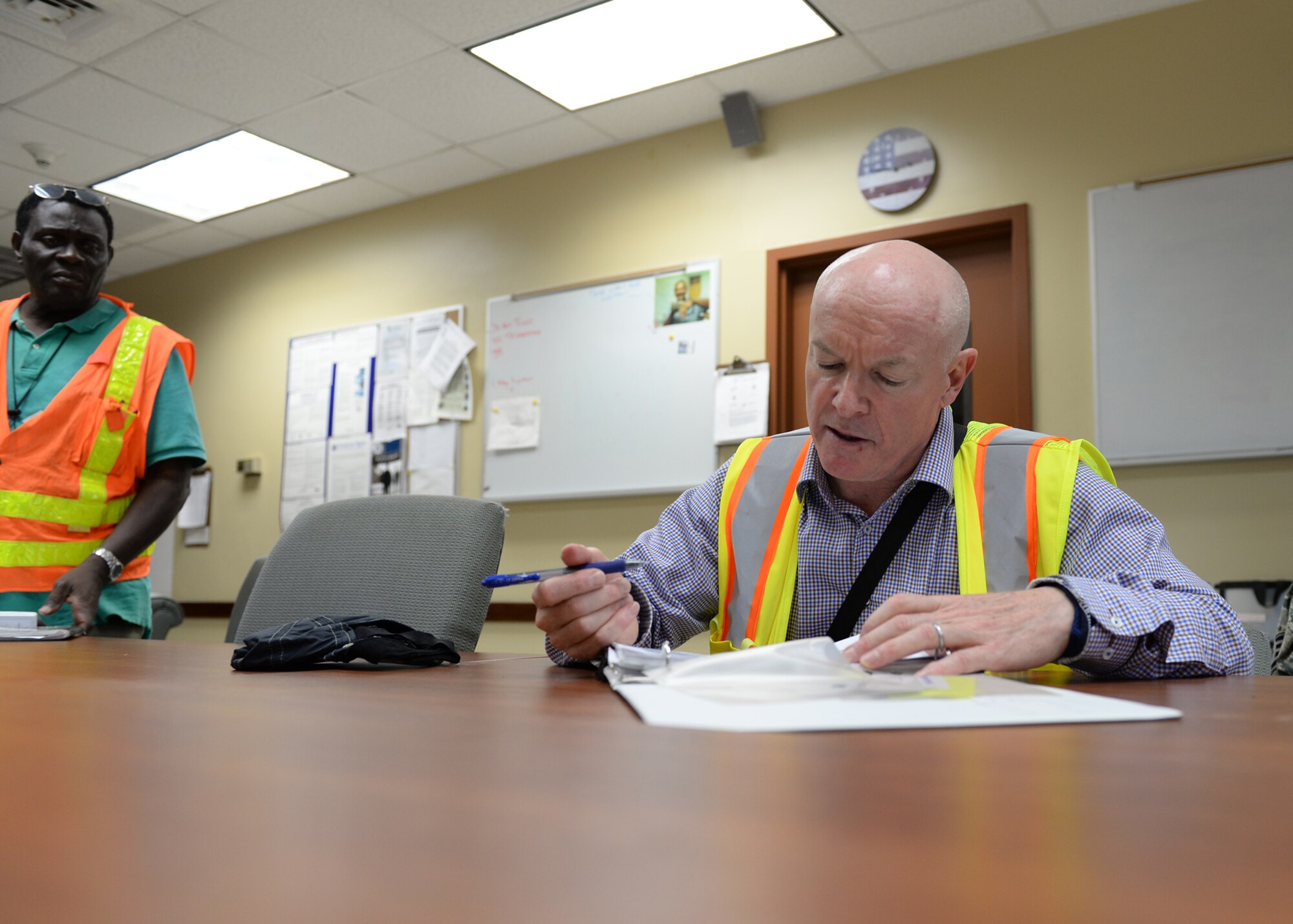 William Kavanagh, 36th Civil Engineer Squadron environmental protection specialist, goes through a checklist during an audit March 16, 2016, at Andersen Air Force Base, Guam. The environmental team performs audits at high-risk facilities to ensure compliance and to make sure buildings remain an environmentally friendly workplace. (U.S. Air Force photo by Senior Airman Cierra Presentado)