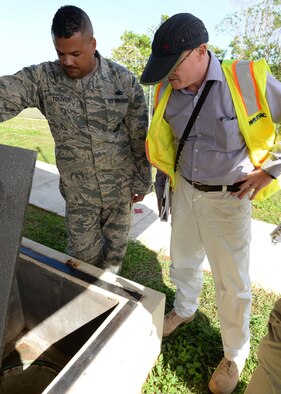 William Kavanagh, 36th Civil Engineer Squadron environmental protection specialist, right, conducts an audit with Tech Sgt. Jeremy Toliver, 36th Security Forces K-9 unit kennel master, as part of the environmental management system process March 16, 2016, at Andersen Air Force Base, Guam. During the audit, Kavanagh and his team went through a pre-audit checklist, and then conducted a thorough inspection of the facility, checking for discrepancies that would deem a building unsafe. (U.S. Air Force photo by Senior Airman Cierra Presentado)