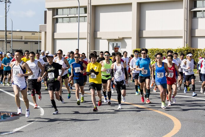 Station residents and Japanese participants begin a half marathon during the 49th Kintai Marathon on Marine Corps Air Station Iwakuni, Japan, April 17, 2016.With more than 500 athletes, the marathon is one of the few events that invites Japanese citizens on the air station and provides a great opportunity for MCAS Iwakuni personnel to show support of their host nation through running, said Mai Tajima, SemperFit recreation specialist. The half marathon first place for the men was Nobuhisa Tanigawa, 35, completing at 1 hour, 13 minutes, 37 seconds, and for the women was Yukiko Kobayakawa, 43, completing at 1:32:26.  (U.S. Marine Corps photo by Cpl. Nathan D. Wicks/Released)