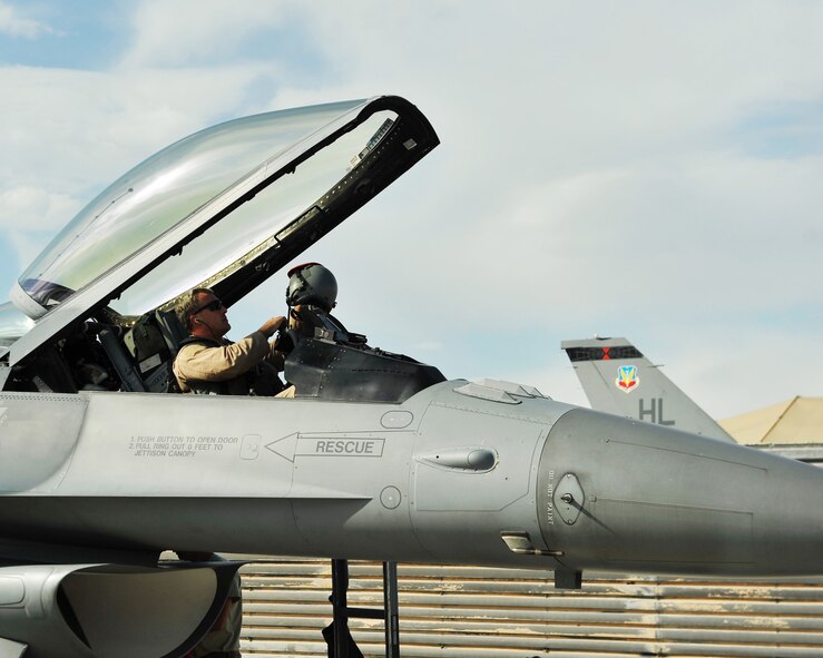 An F-16 pilot from the 457th Expeditionary Fighter Squadron prepares to exit his aircraft after arriving to Bagram Airfield, Afghanistan, 27 April, 2016. The 457th EFS provides overwatch and close air support to U.S. and coalition ground forces throughout the Afghanistan area of operation. (U.S. Air Force photo by Capt. Korey Fratini/released). 