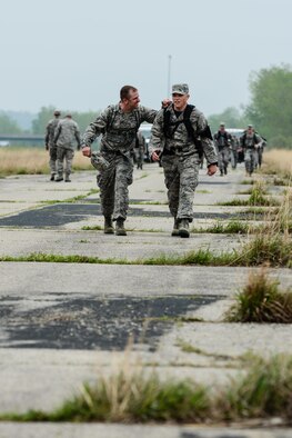 Airmen assigned to the Missouri Air National Guard‘s139th Airlift Wing participate in a ruck march in Elwood, Kan., April 22, 2016. The Airmen were qualifying for the German Armed Forces Badge for Military Proficiency. The event included running, swimming, sprints, pullup hang, pistol marksmanship and a ruck march. Participants could qualify in bronze, silver or gold categories. (U.S. Air National Guard photo/Tech. Sgt. Michael Crane)
