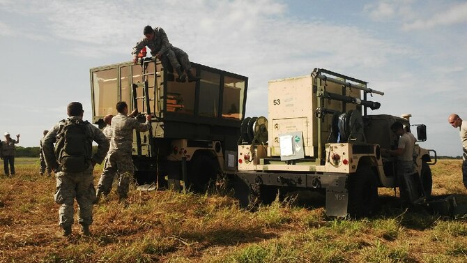 An Air Force team sets up a mobile air traffic control tower at Eloy Alfaro International Airport in Manta, Ecuador, April 26, 2016. The portable tower will help local controllers increase the flow of humanitarian aid entering the country. The United States, in coordination with the Ecuadorian government, deployed 12 U.S Airmen to Ecuador to support international relief efforts for victims of a 7.8-magnitude earthquake. (Courtesy photo/U.S. Embassy Quito)