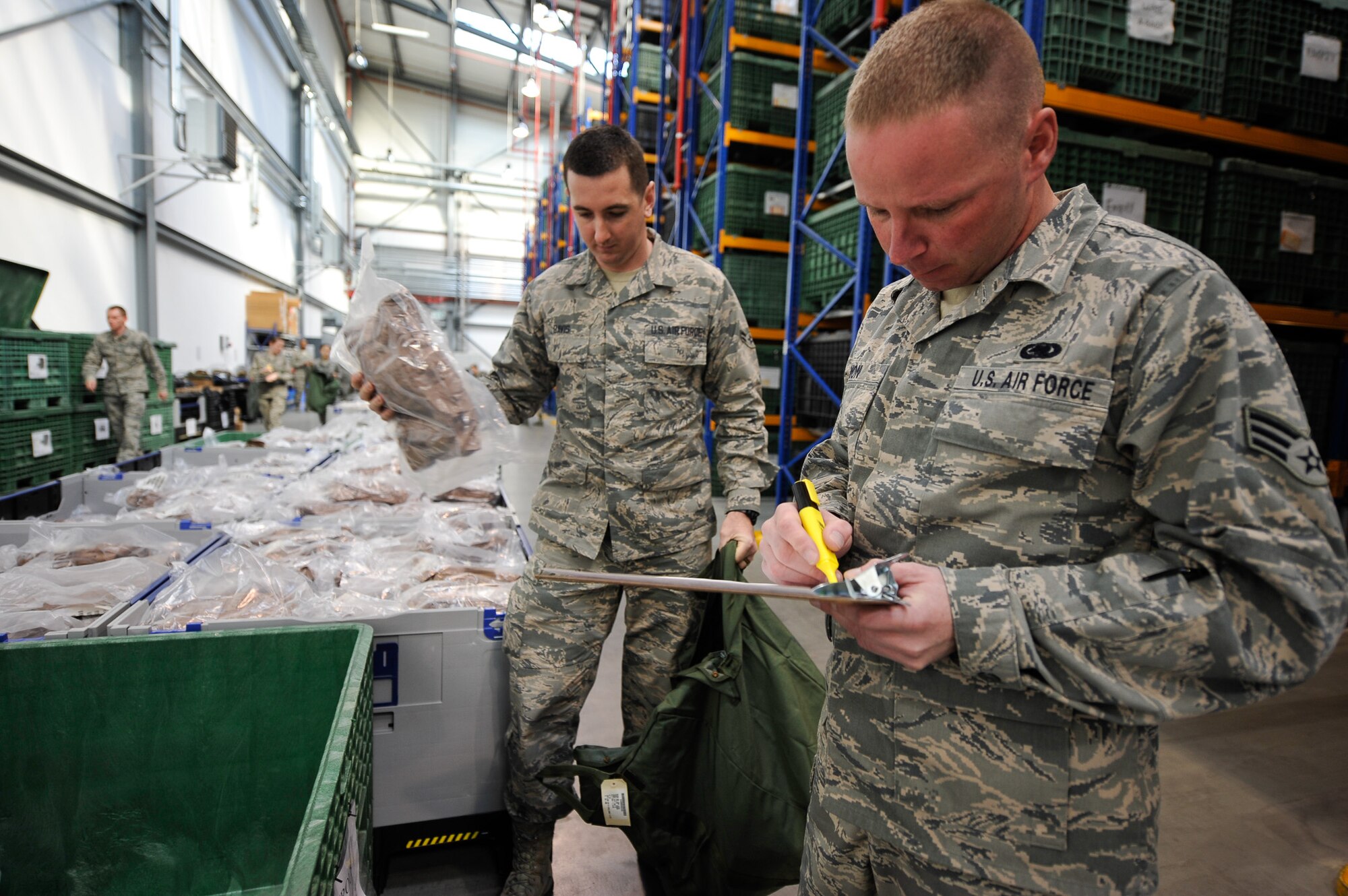 Senior Airman Zachary Simon, 445th Air Reserve Base Logistics Readiness Squadron supply technician at Wright-Patterson Air Force Base, Ohio, goes through a checklist of individual protective equipment items being issued during Wing Thunder April 20, at Ramstein Air Base, Germany. Simon is one of four logistics reservists completing their annual training at Ramstein. (U.S. Air Force photo/Staff Sgt. Leslie Keopka)