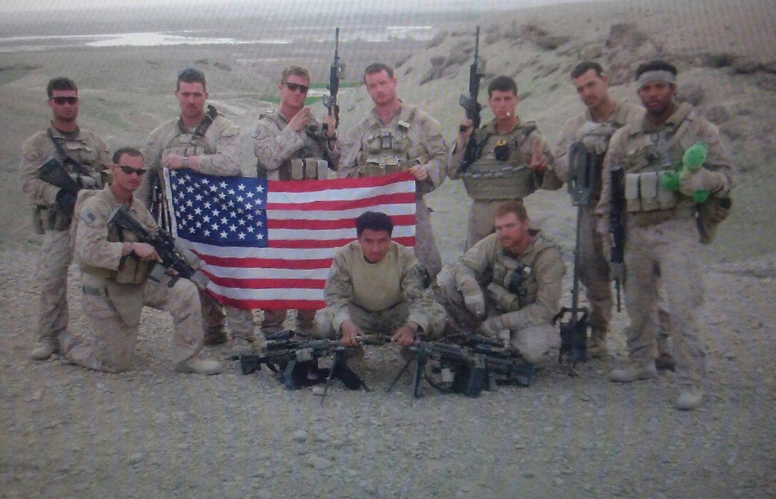 Marines are known as the most elite fighting force in the nation. Earning the prestigious Eagle, Globe and Anchor means joining a brotherhood and sisterhood that consists of about 183,883 service members; equating to around 13% of the nation’s military manpower. Sergeant Michael Butler (pictured far right holding the flag) a recruiter out of Recruiting Sub Station Mobile, Recruiting Station Montgomery, is one of the people who have the honor of calling himself one of the few and the proud. (U.S. Marine Corps courtesy photo)