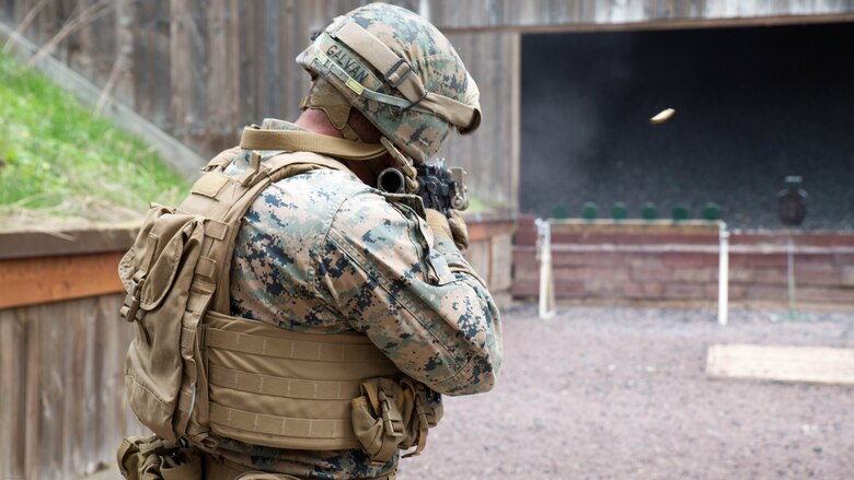 U.S. Marine Corps Cpl. Gustavo Galvan, a team leader with Special Purpose Marine Air-Ground Task Force-Crisis Response-Africa, fires at a set of targets during a stress shooting exercise held by U.S. Army Special Forces in Germany, Apr. 12, 2016. The Marines ran through a timed firing course with flash-bang grenades and challenging shooting positions to put their marksmanship skills to the test in a stressful environment. After the course of fire, the squads ran as a team to the Military Operations on Urban Terrain town to complete a speed and agility course. 