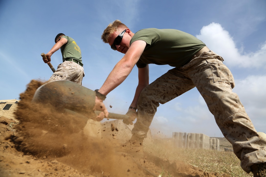 Lance Cpl. Seth A. Gordon, a field radio operator with the 11th Marine Expeditionary Unit, shovels a trench to conceal network cables during the build-up of a shore-based expeditionary command post as part of MEU Exercise at Marine Corps Base Camp Pendleton, California, April 26, 2016. The exercise ensures each element of the MEU is able to communicate, coordinate, and control all organic units, with each element demonstrating its ability to command and control from an expeditionary shore site.