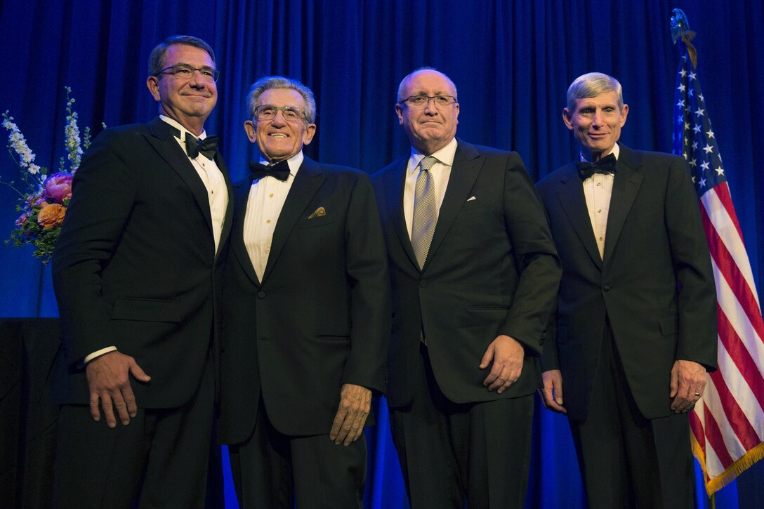 Defense Secretary Ash Carter, far left, poses for a photograph with Robert Belfer, second from left, BENS Chairman Bruce Mosler, second from right, and BENS President & CEO Retired Air Force Gen. Norton A. Schwartz, at the Business Executives for National Security Eisenhower Award dinner in Washington D.C., April 28, 2016.  Carter and Belfer were presented with the 2016 Eisenhower Award at the event. DoD photo by Air Force Senior Master Sgt. Adrian Cadiz