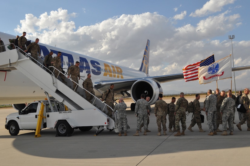 Soldiers assigned to the 716th Eng. Co. are greeted as they deplane at the Silas. L. Copeland Arrival/Departure Airfield Control group April 18, after arriving stateside after a nine-month deployment to the Middle East.