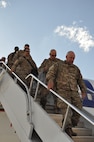 Soldiers assigned to the 716th Engineer Company, deplane after arriving at the Silas. L. Copeland Arrival/Departure Airfield Control group April 18.