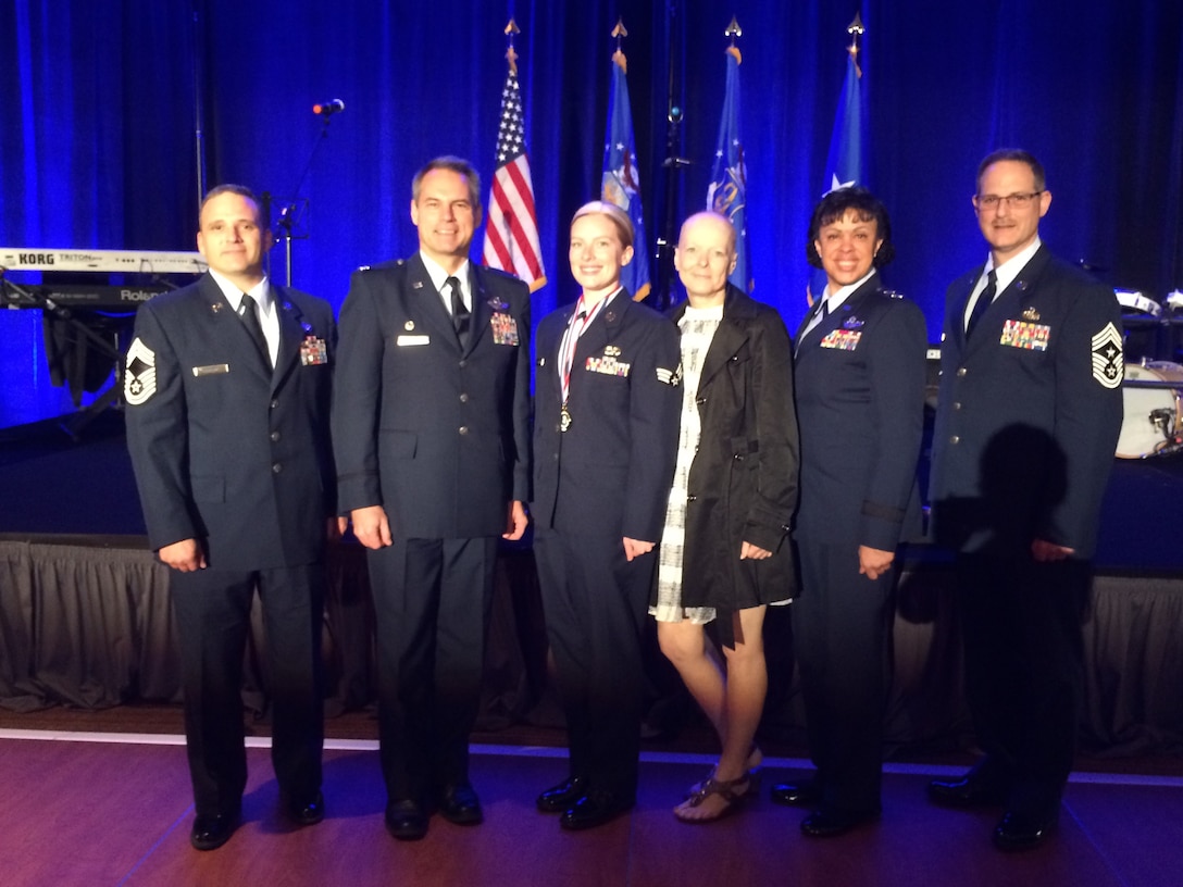 Senior Airman Keirsten Englund, 27th Aerial Port Squadron, is named 22nd Air Force Outstanding Airman of the Year at a ceremony at Dobbins ARB, Georgia. 

Englund (3rd from left) stands with (from left) Chief Master Sgt. Michael Sciarra, 27 APS; Col. Anthony Polashek, 934 AW commander; her mother Trish Englund; Maj. Gen. Stayce Harris, 22 AF commander; and Chief Master Sgt. Bryan Payne, 934 AW command chief. (Courtesy Photo)

