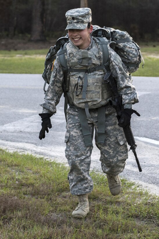 Army Reserve Spc. Kayla Bundy, a wheeled vehicle mechanic with the 1st Battalion, 414th Infantry Regiment, 95th Training Division, turns a corner at the halfway point of the 10-mile forced march during the 2016 108th Training Command Best Warrior competition at Fort Jackson, S.C., March 22, 2016. Army photo by Sgt. 1st Class Brian Hamilton