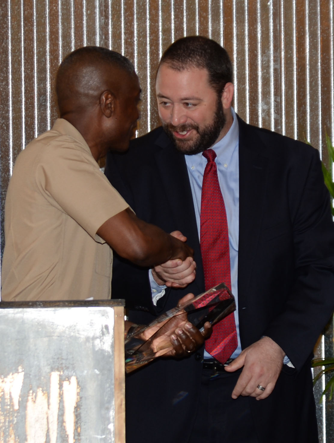Col. James C. Carroll III, commanding officer, Marine Corps Logistics Base Albany, receives the 2016 Only One Albany Industry Award from Chris Cohilas, chairman, Albany-Dougherty Economic Development Commission, Albany, Ga., during a special Rise-n-Shine breakfast honoring local industries and hosted by the Albany Area Chamber of Commerce, recently.