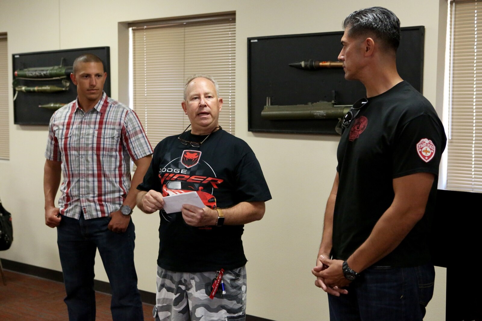 Andy Weiss addresses Marines and their families during a family day hosted by 1st Explosive Ordnance Disposal Company, 7th Engineer Support Battalion, 1st Marine Logistics Group, aboard Camp Pendleton, Calif., April 23, 2016. Weiss is the president of the Viper Club of Southern California. The Viper Club made a donation of over $4,000 to the EOD Warrior Foundation as a thank you to those who have given everything. The family day celebration included food, family activities, and a line-up of show cars. (U.S. Marine Corps photo by Cpl. Carson Gramley/released)