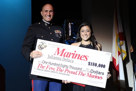 Ms. Julianna Deluca from Spanish River High School in Boca Raton, Fla., accepted the $180,000 Marine-Option, Naval Reserve Officers Training Corps Scholarship. Deluca plans on attending Penn State University and upon completion will be commissioned as a 2nd Lieutenant in the Marine Corps. The scholarship is presented by Maj. David Tumanjan, Commanding Officer of Recruiting Station Fort Lauderdale. (Official Marine Corps photo by Sgt. Michael Lopez/Released)