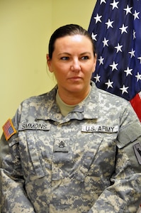 Staff Sgt. Heather Simmons, a native of Jacksonville, Florida assigned to the U.S. Army Reserve's 99th Regional Support Command at Joint Base McGuire-Dix-Lakehurst, New Jersey, waits to receive her appointment as a Warrant Officer Candidate April 29.