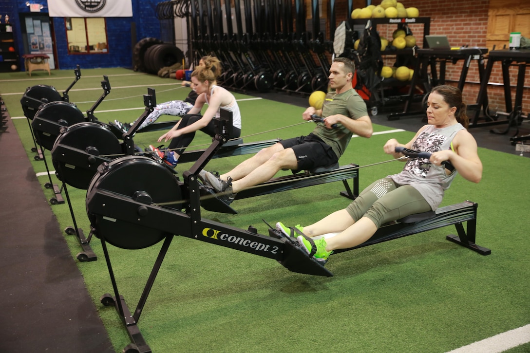 Major Misty Posey, right, participates in a workout at the Reebok Headquarters' Honor Your Days event in Canton, Mass., April 28, 2016. The workout followed a panel discussion where Reebok showed their new television spot to those in attendance. Posey was invited to the event as a strong female figure due to her accomplishments in the Marine Corps. Posey came up with a program to help men and women increase their number of pull-ups. She says she hopes to spread the word about her program to help men and women across the nation.
