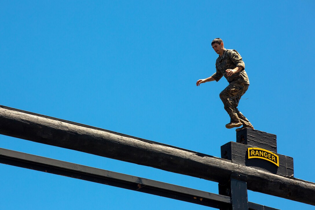 Army 1st Lt. Colton Barber moves across a water confidence obstacle during the Best Ranger Competition 2016 at Fort Benning, Ga., April 17, 2016. Barber is assigned to the 25th Infantry Division. Army photo by Spc. Steven Hitchcock