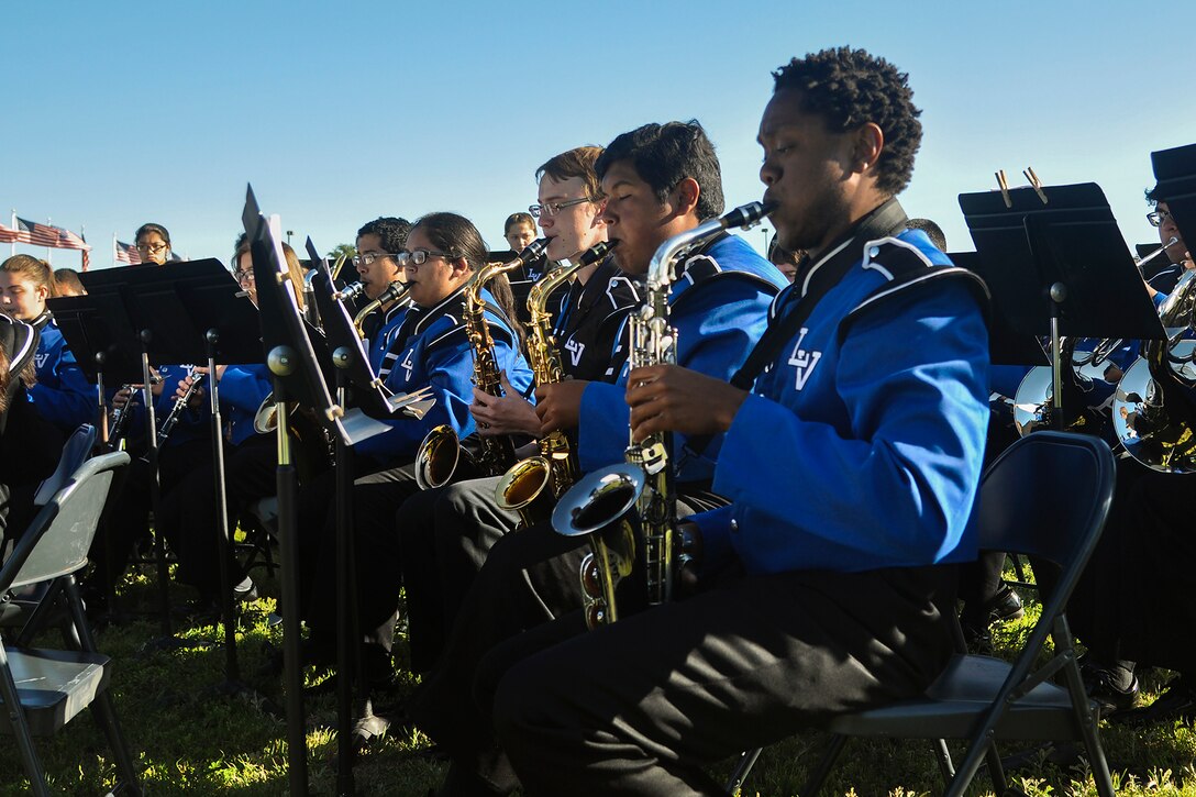 Lakeview High School band members play music during the Community College of the Air Force graduation at the parade field on Goodfellow Air Force Base, Texas, April 27, 2016. The band played the national anthem, Pomp and Circumstance and the Armed Forces Medley. (U.S. Air Force photo by 2nd Lt. Tisha Wilkerson/Released)