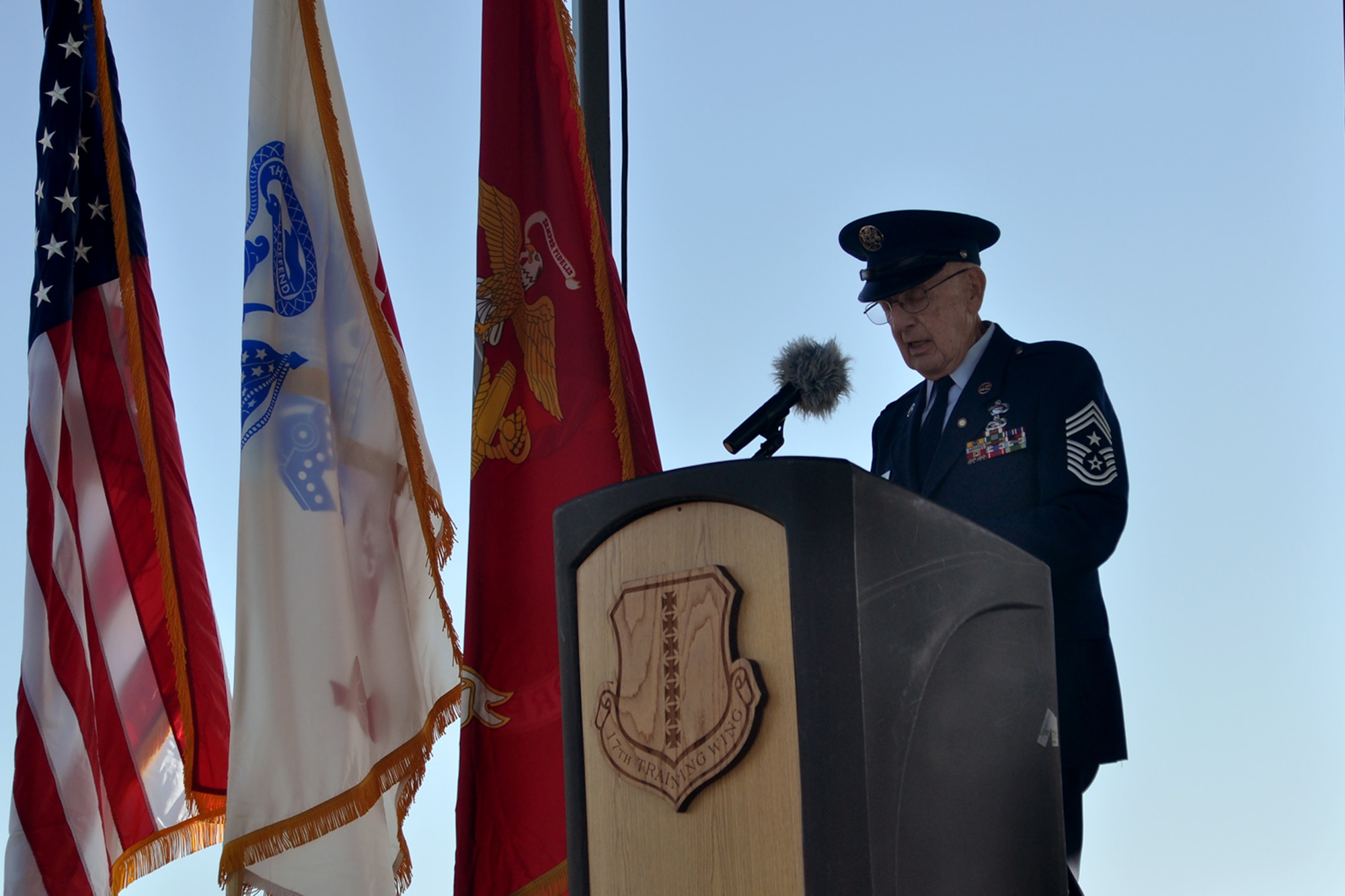 Retired U.S. Air Force Chief Master Sgt. Robert A. Mehaffey speaks at the Community College of the Air Force graduation at the parade field on Goodfellow Air Force Base, Texas, April 27, 2016. Mehaffey was the first senior enlisted advisor at Goodfellow 41 years ago. (U.S. Air Force photo by 2nd Lt. Tisha Wilkerson/Released)
