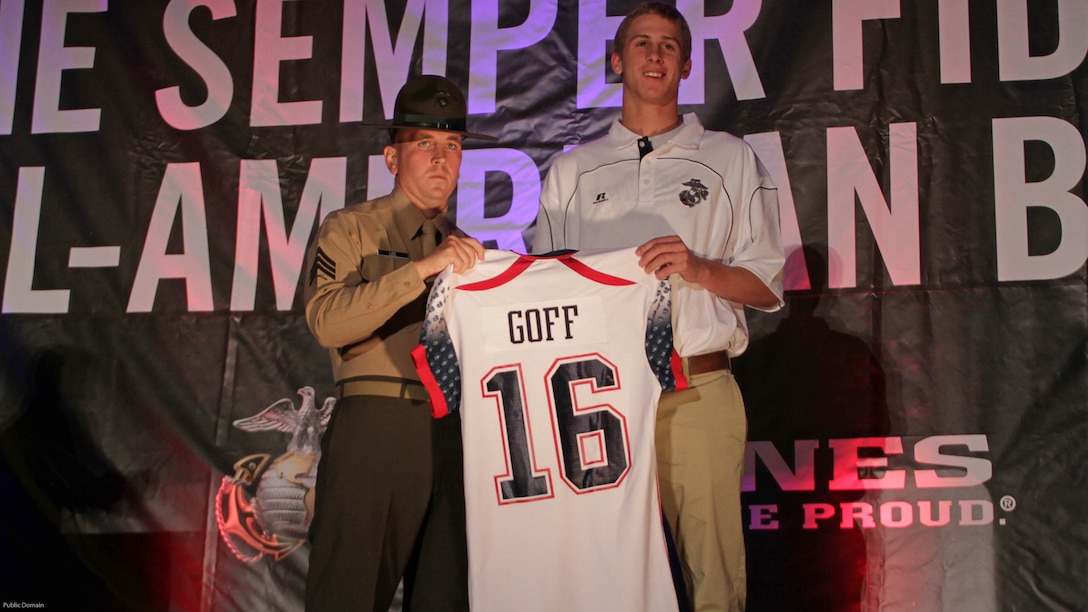 Drill instructor Sgt. Matthew Lee presents Jared Goff with his Semper Fidelis All-American Bowl jersey at a banquet Jan. 3, 2013. More than 100 athletes were selected to participate in the event. The Los Angeles Rams drafted Goff with the number one pick in the 2016 NFL draft, April 28, 2016.