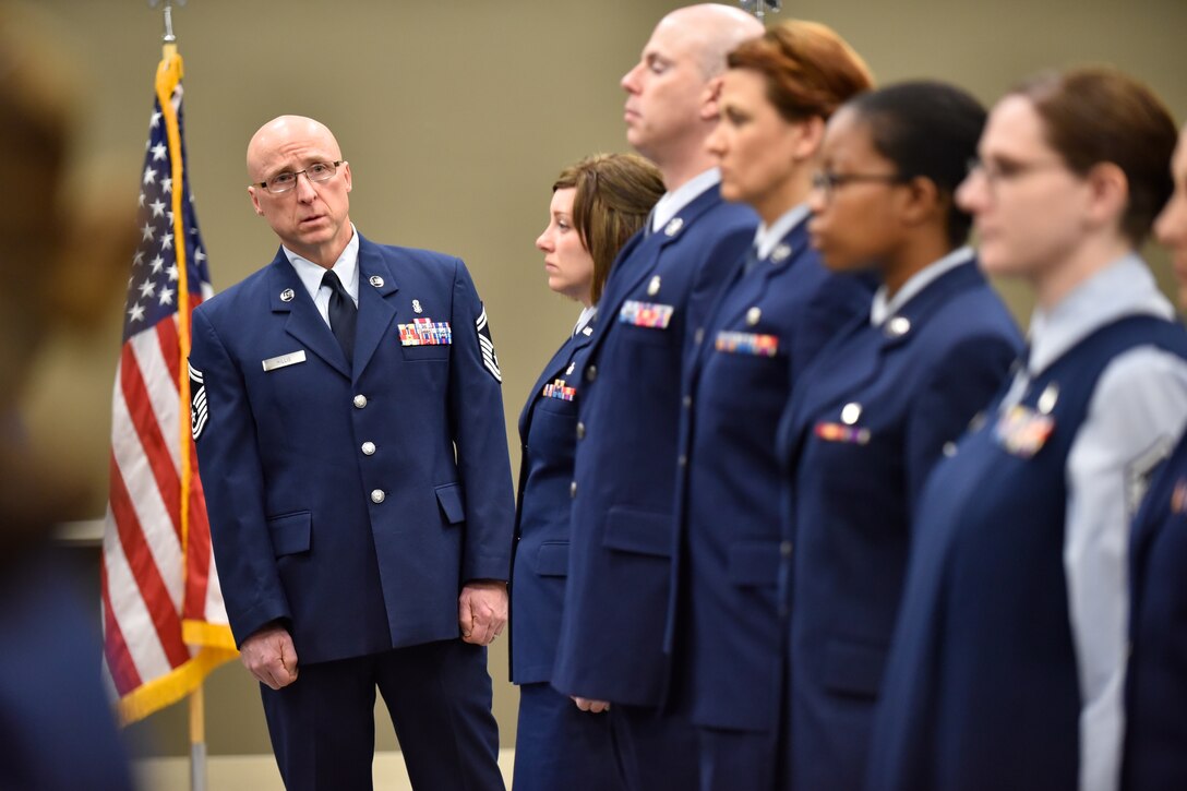 Senior Master Sgt. Scott Hillis, a first sergeant in the 932nd Airlift Wing, takes a look down the line to inspect uniforms of his Aeromedical Staging Squadron members during an open ranks inspection April 6, 2016.  (U.S. Air Force photo by Tech. Sgt. Christopher Parr)