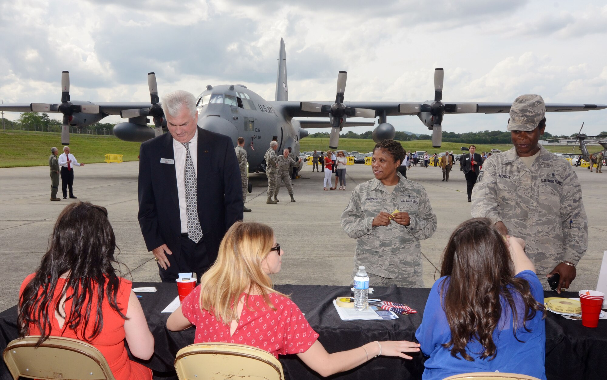 Military and civilian guests register as the Dobbins Business After Hours, held at Dobbins Air Reserve Base, Ga. April 27, 2016. The program, sponsored by the 94th Airlift Wing is designed to join local community members and base personnel in an evening of interaction. Guests were treated to food prepared by Local restaurants. (U.S. Air Force photo by Don Peek)