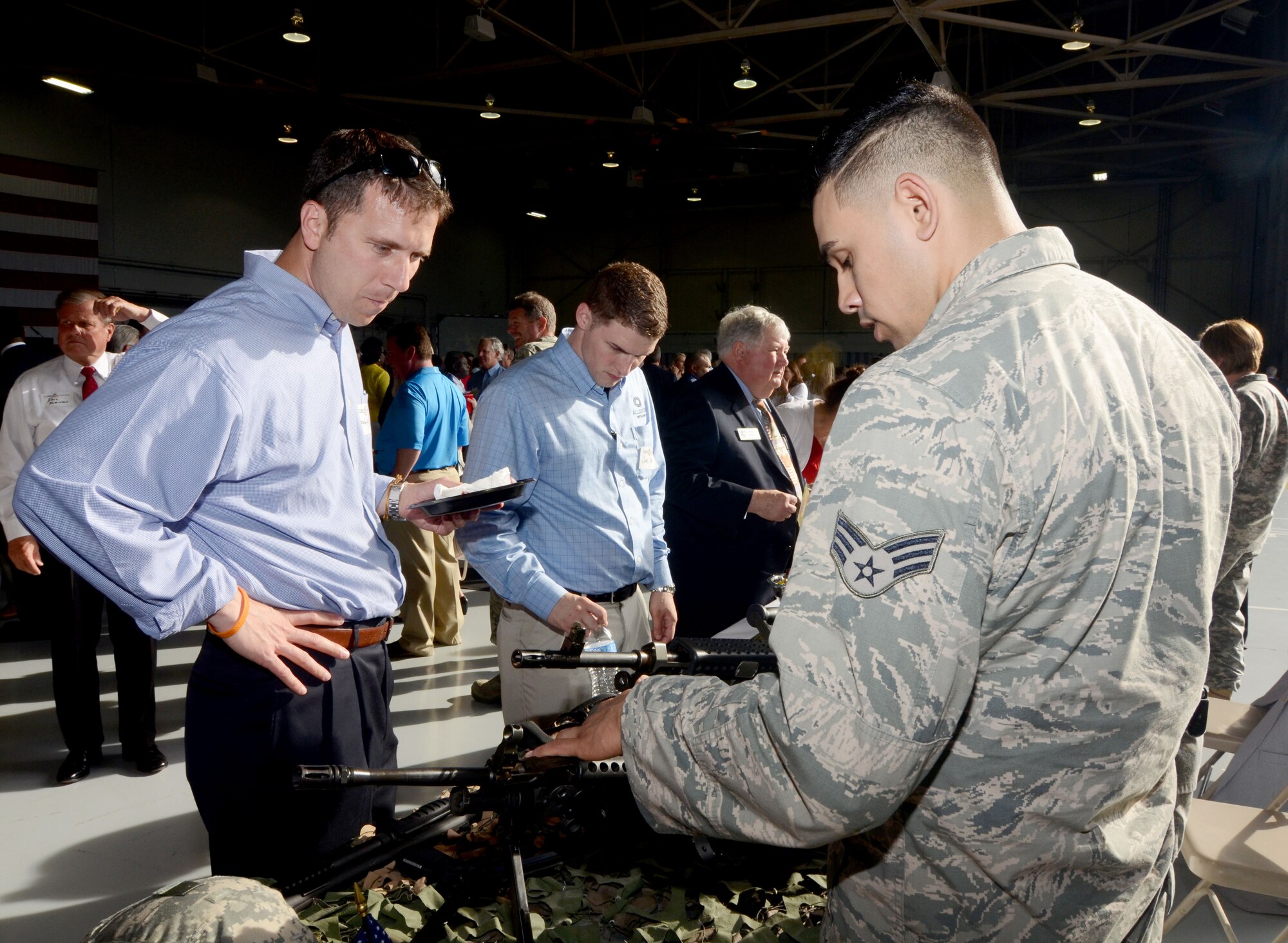 Military and civilian guests register as the Dobbins Business After Hours, held at Dobbins Air Reserve Base, Ga. April 27, 2016. The program, sponsored by the 94th Airlift Wing is designed to join local community members and base personnel in an evening of interaction. Guests were treated to food prepared by Local restaurants. (U.S. Air Force photo by Don Peek)