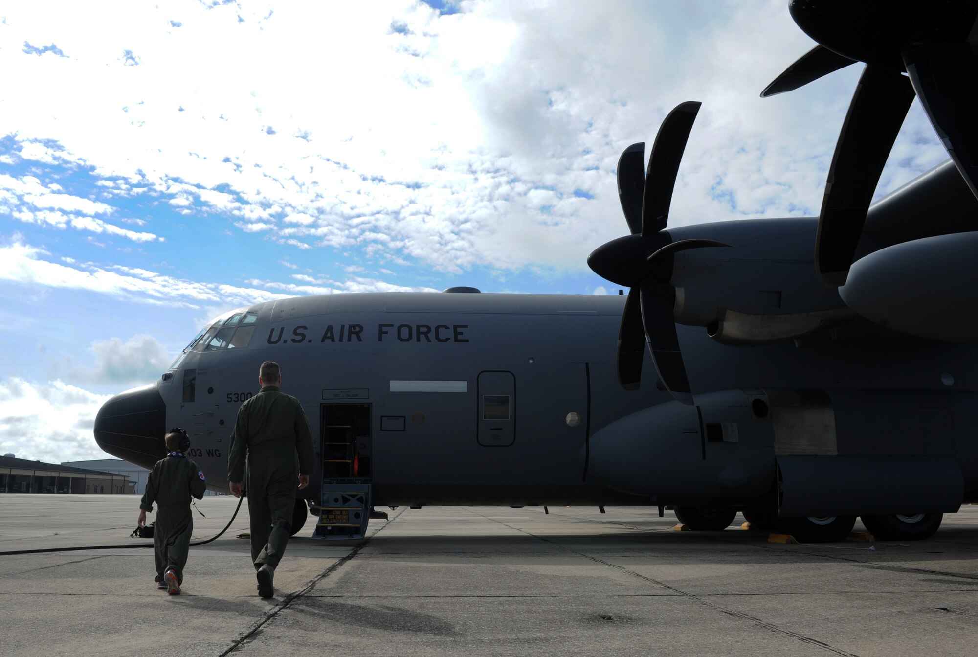 Maj. Jerry Rutland, 403rd Wing chief pilot, escorts Jon Bryant “JB” Orso to a WC-130J Super Hercules during the 403rd Wing’s first Pilot for a Day event April 26, 2016, Keesler Air Force Base, Miss. Orso, who served as an honorary Air Force Reserve second lieutenant, is in remission after receiving treatment for Acute Lymphoblastic Leukemia. Pilot for a Day is a community outreach program for children who live with a chronic or life-threatening disease or illness. (U.S. Air Force photo by Kemberly Groue)
