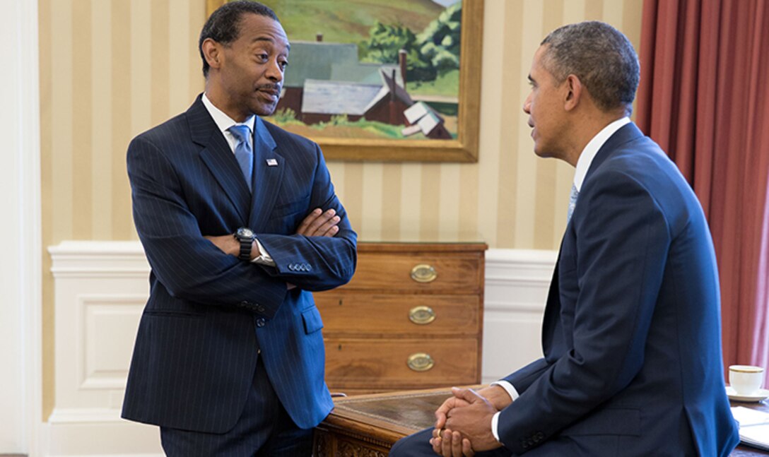 Dr. Jonathan Woodson, assistant secretary of defense for health affairs, speaks with President Barack Obama at the White House. White House photo