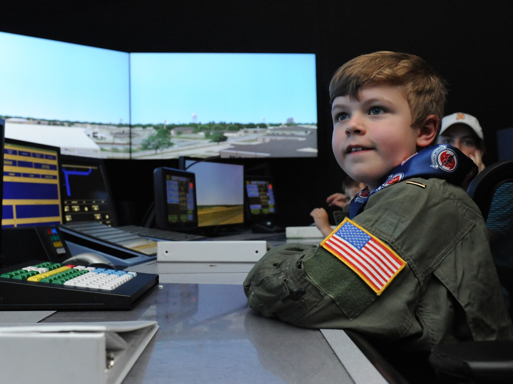 Jon Bryant “JB” Orso receives a tour of an air traffic control tower simulator during the 403rd Wing’s first Pilot for a Day event April 26, 2016, Keesler Air Force Base, Miss. Orso, who served as an honorary Air Force Reserve second lieutenant, is in remission after receiving treatment for Acute Lymphoblastic Leukemia. Pilot for a Day is a community outreach program for children who live with a chronic or life-threatening disease or illness. (U.S. Air Force photo by Kemberly Groue)