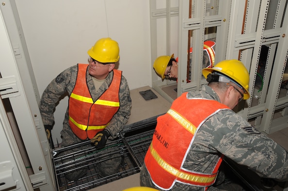 Select personnel from 15 Air National Guard Engineering and Installation organizations are installing more than 600 miles of cabling in support of the US Strategic Command, Command and Control facility construction project. Civilian contractors would have required costly security escorts at all times causing costs to soar even higher than the $1.2 billion projection. Members from Mississippi, Maine, Massachusetts, New York, Texas, Pennsylvania, Ohio, Illinois, Georgia, Tennessee, Louisiana, Oklahoma, Utah and Minnesota are already proving their value to the project. (U.S. Air Force photo by Steve Cunningham)