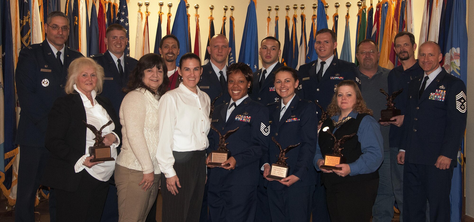 Col. Stephen Kravitsky, 90th Missile Wing commander, and Chief Master Sgt. Samuel Couch, 90th MW command chief, pose with the wing’s first quarter award winners April 29, 2016, inside the Trail’s End Event Center. The wing held a celebration breakfast for all the nominees and presented the awards to the winners during a ceremony. 