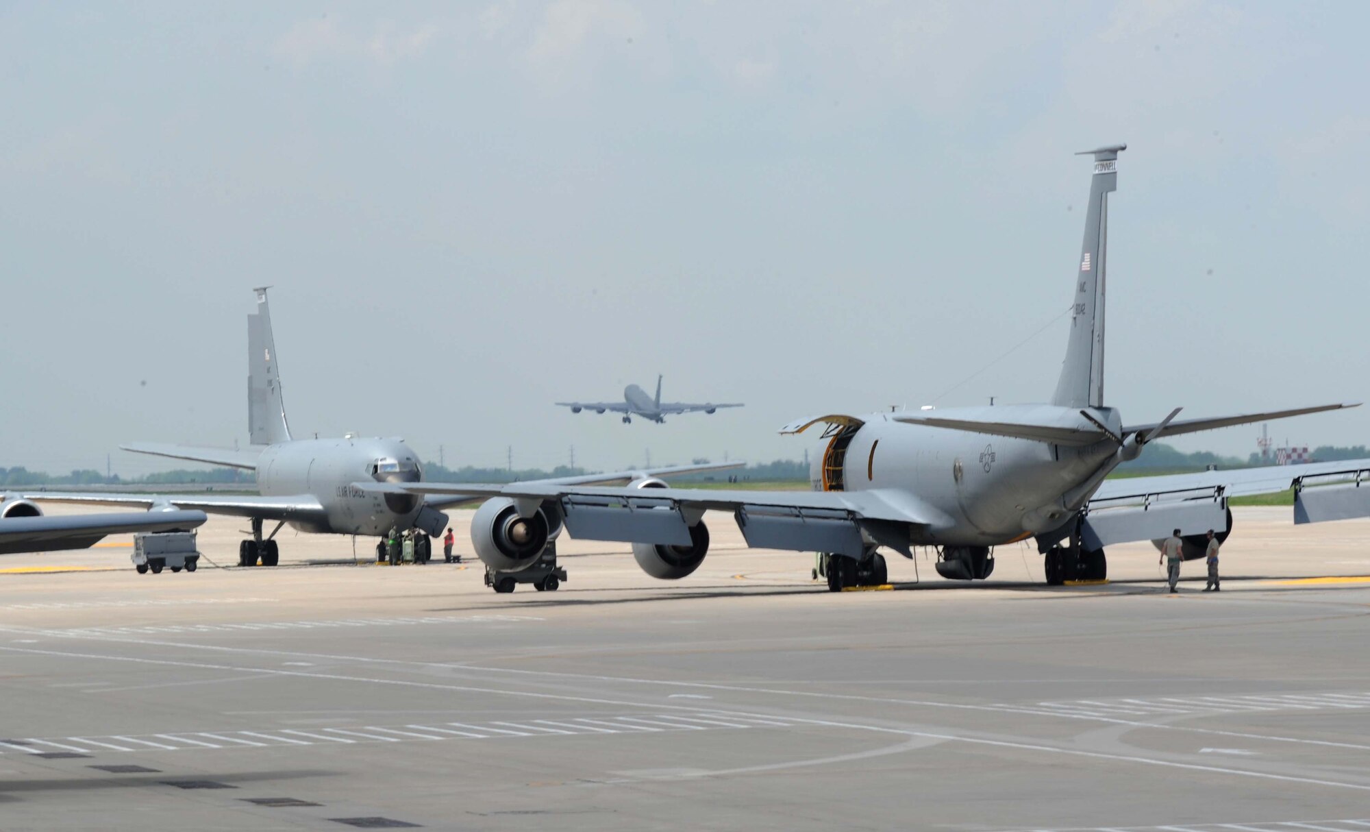 Two KC-135 Stratotankers sit on the flightline before being evacuated, April 26, 2016, at McConnell Air Force Base, Kansas. Wing leadership made the decision to move aircraft out of the path of incoming storms. (U.S. Air Force photo by Senior Airman Tara Fadenrecht) 
