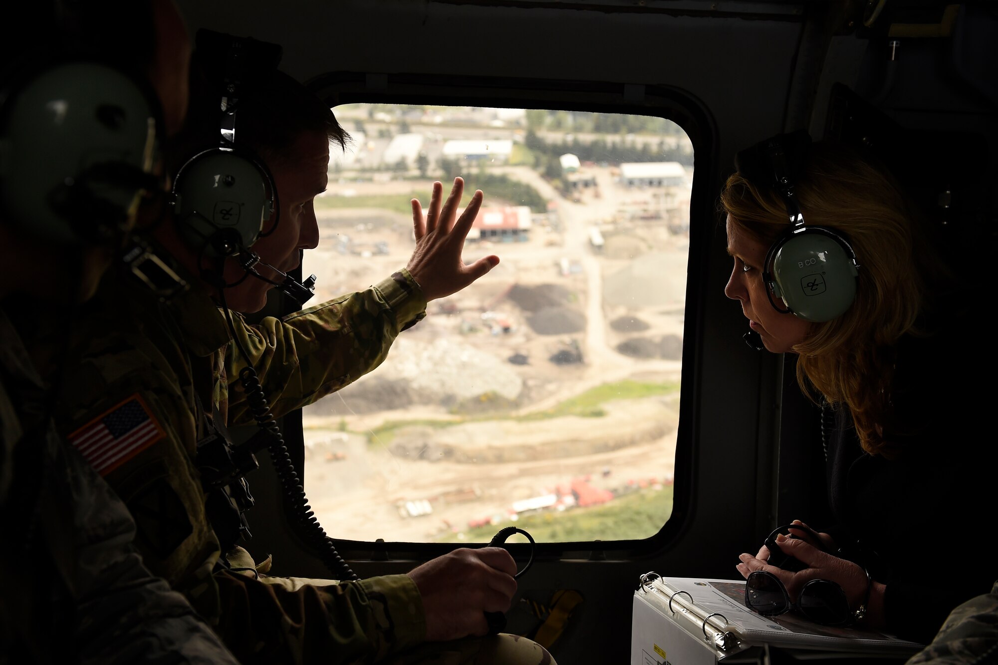 Secretary of the Air Force Lee James (right) is briefed by Col. Dan Morgan, Joint Base Lewis-McChord installation commander, during an aerial tour of Joint Base Lewis-McChord, Wash., April 26, 2016. The aerial tour provided a perfect perspective for some of the issues they talked about including the close proximity of the local community to the end of the McChord Field flight line. (U.S Air Force photo/Tech. Sgt. Tim Chacon) 