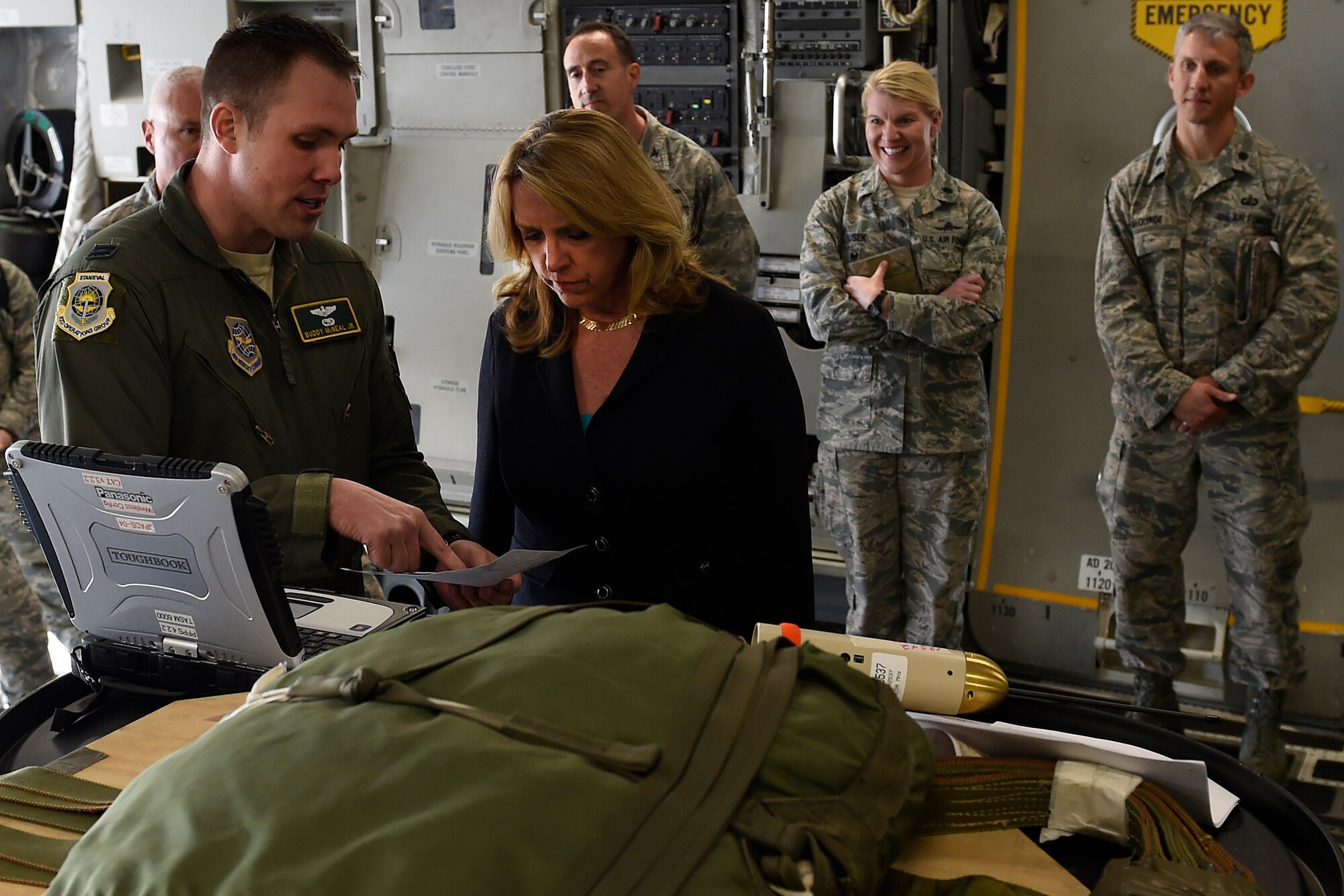 Secretary of the Air Force Deborah Lee James (second from left) talks with Capt. Buddy McNeal, 62nd Operations Group C-17 Globemaster III pilot, April 26, 2016, at Joint Base Lewis-McChord, Wash., about Joint Precision Air Drop Systems. JPADS uses GPS to provide increased accuracy delivery to ground units. (U.S Air Force photo/Tech. Sgt. Tim Chacon)