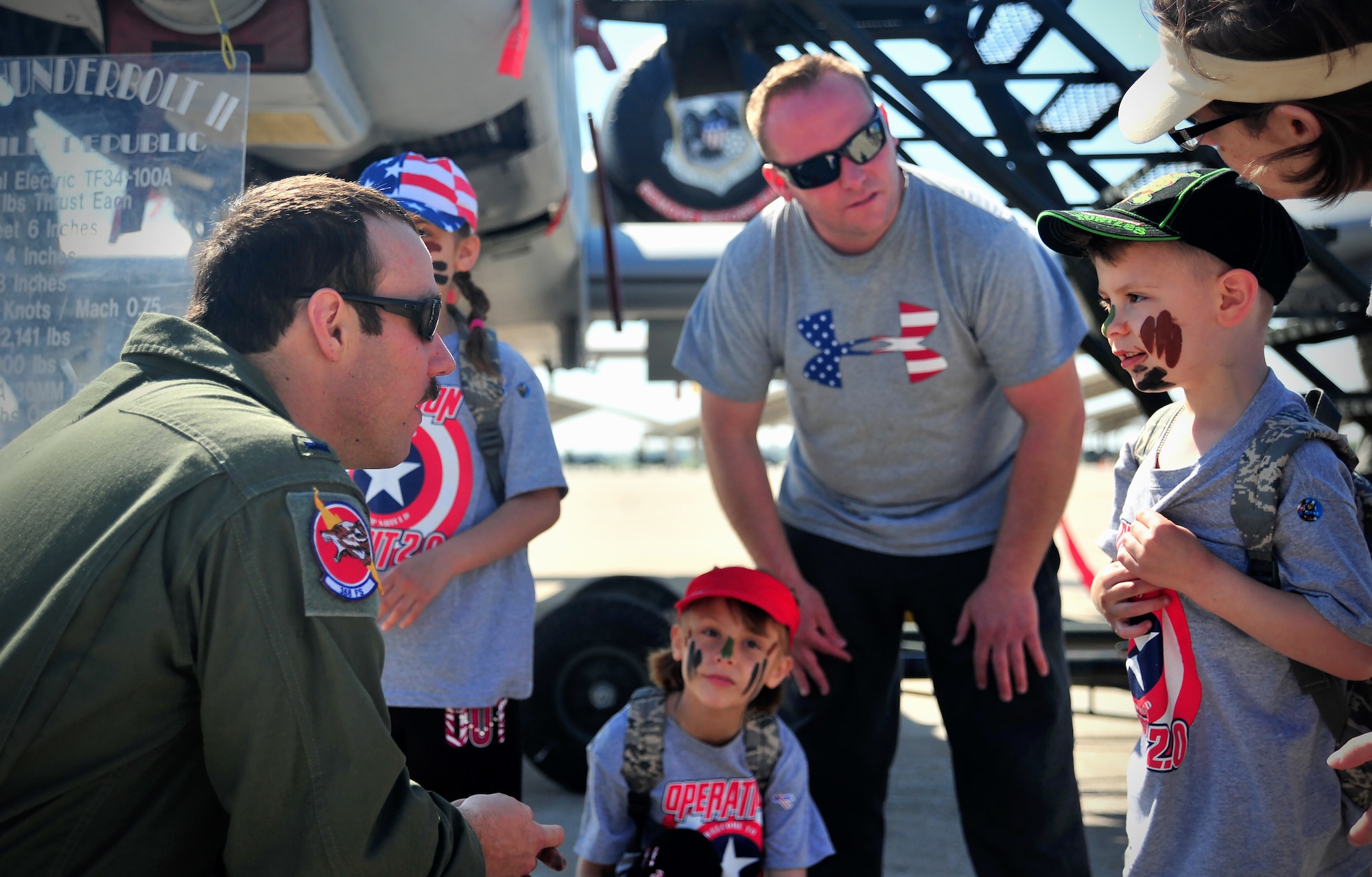 U.S. Air Force 1st Lt. Randall Ott, 358th Fighter Squadron pilot, answers questions from Operation Spirit participants at Whiteman Air Force Base, Mo., April 23, 2016. Ott served as a subject matter expert on the A-10 Thunderbolt II aircraft during the event. (U.S. Air Force photo by Senior Airman Jovan Banks)