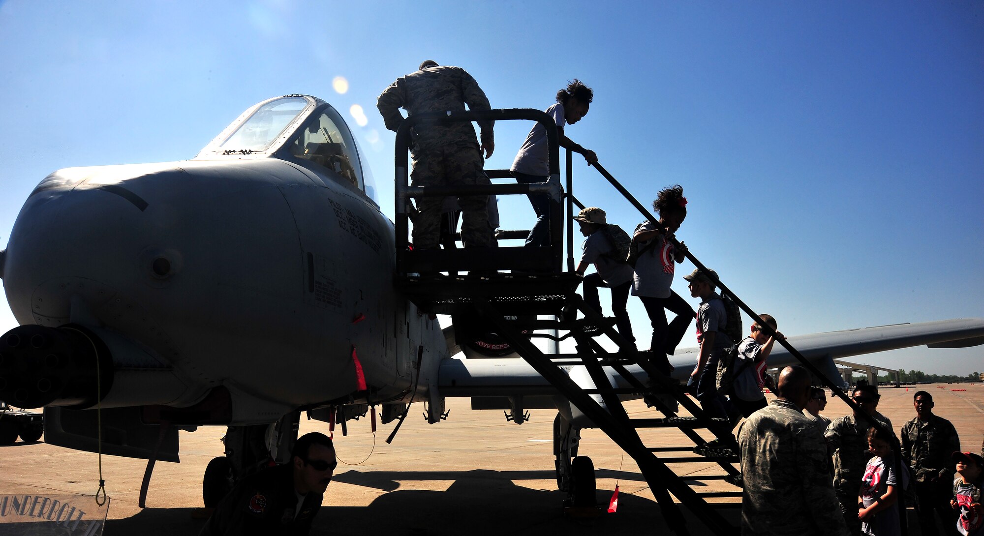 Operation Spirit participants take turns viewing an A-10 Thunderbolt II during Operation Spirit at Whiteman Air Force Base, Mo., April 23, 2016. During the event multiple aircraft were on display including an A-10, B-2 Spirit and T-38 Talon. (U.S. Air Force photo by Senior Airman Jovan Banks) 