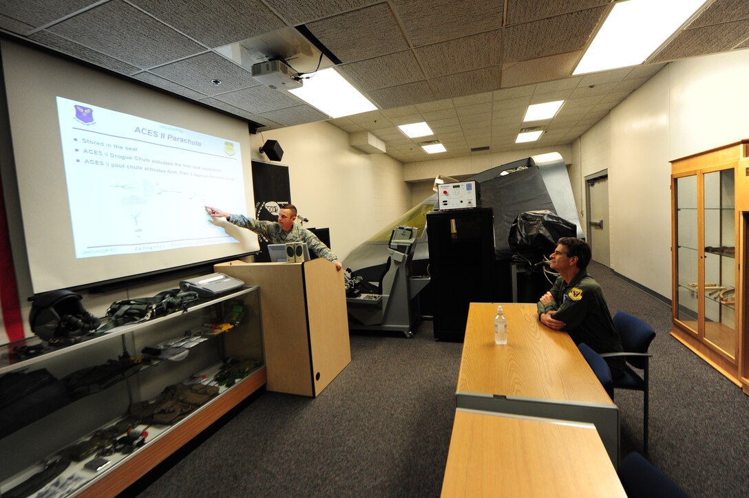 U.S. Air Force Tech. Sgt. Joshua Riffe, a 509th Operation Support Squadron aircrew flight equipment supervisor, left, details aircrew procedures to Dean Kamen, the FIRST Robotics founder, at Whiteman Air Force Base, Mo., April 26, 2016. Kamen met Airmen and FIRST Robotics alumni during his visit and received an incentive flight in a B-2 Spirit. The U.S. Air Force and FIRST Robotics share an interest in developing youth into future leaders through exposure to education in science, technology, engineering and mathematics. (U.S. Air Force photo by Airman 1st Class Keenan Berry)