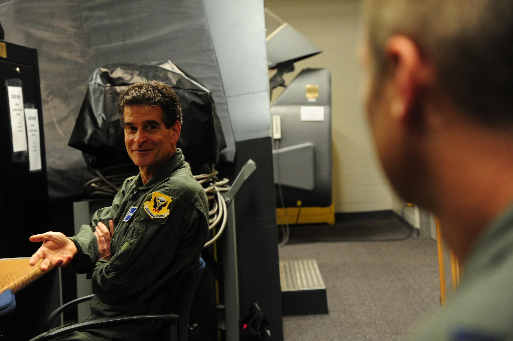 Dean Kamen, the FIRST Robotics founder, left, speaks with U.S. Air Force Capt. Ryan Magner, a 509th Operations Support Squadron B-2 Spirit pilot, about B-2 egress procedures at Whiteman Air Force Base, Mo., April 26, 2016. Kamen met Airmen and FIRST Robotics alumni during his visit and received an incentive flight in a B-2 Spirit. The U.S. Air Force and FIRST Robotics share an interest in developing youth into future leaders through exposure to education in science, technology, engineering and mathematics. (U.S. Air Force photo by Airman 1st Class Keenan Berry)