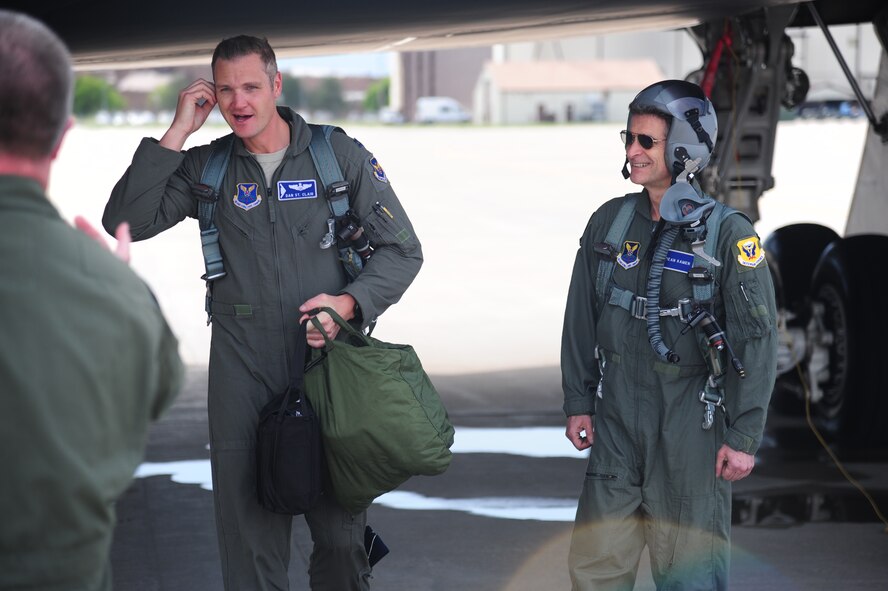 U.S. Air Force Capt. Daniel St. Clair, a B-2 Spirit pilot and FIRST Robotics alumni, left, and Dean Kamen, FIRST Robotics founder, right, exit from a B-2 at Whiteman Air Force Base, Mo., April 26, 2016. Kamen met with Airmen during a tour of Whiteman and also received an incentive flight in a B-2. (U.S. Air Force photo by Senior Airman Joel Pfiester)